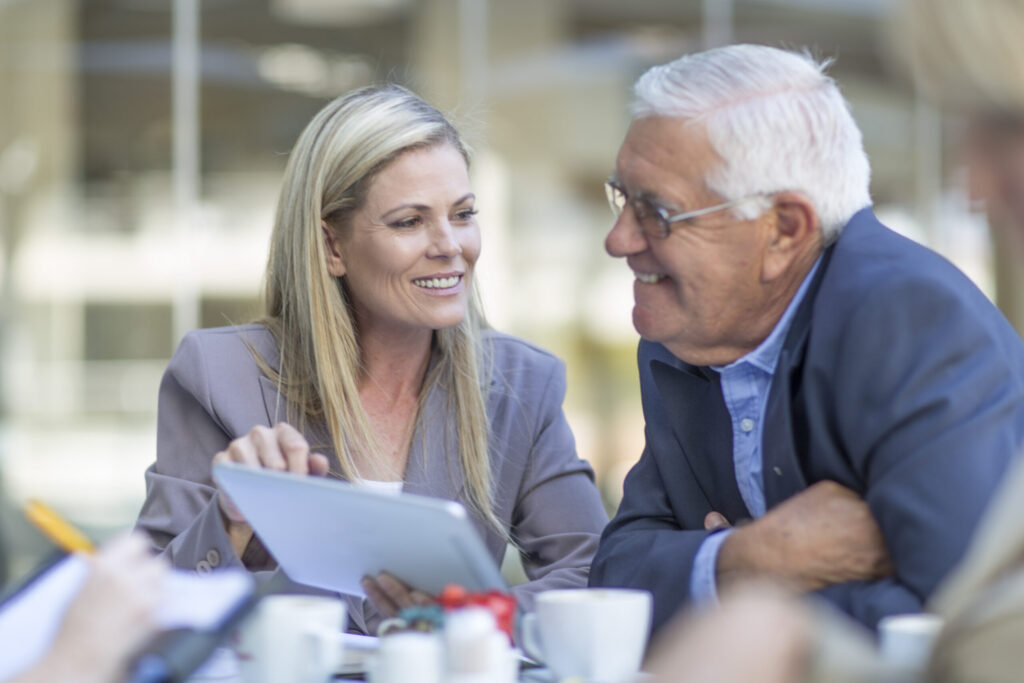 businesswoman and man talking at coffee break on h 2026 01 09 10 51 06 utc scaled.jpg